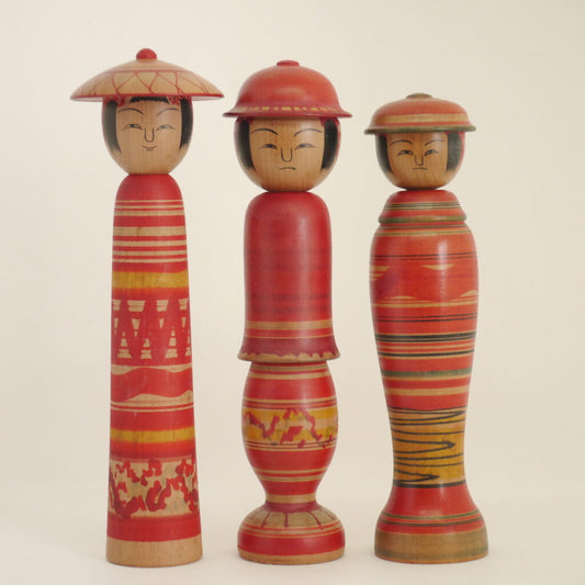 Tsuchiyu Kokeshi dolls wearing hats