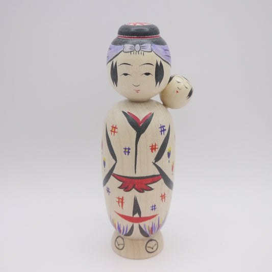 Kokeshi doll by Hideaki Onuma Babysitting