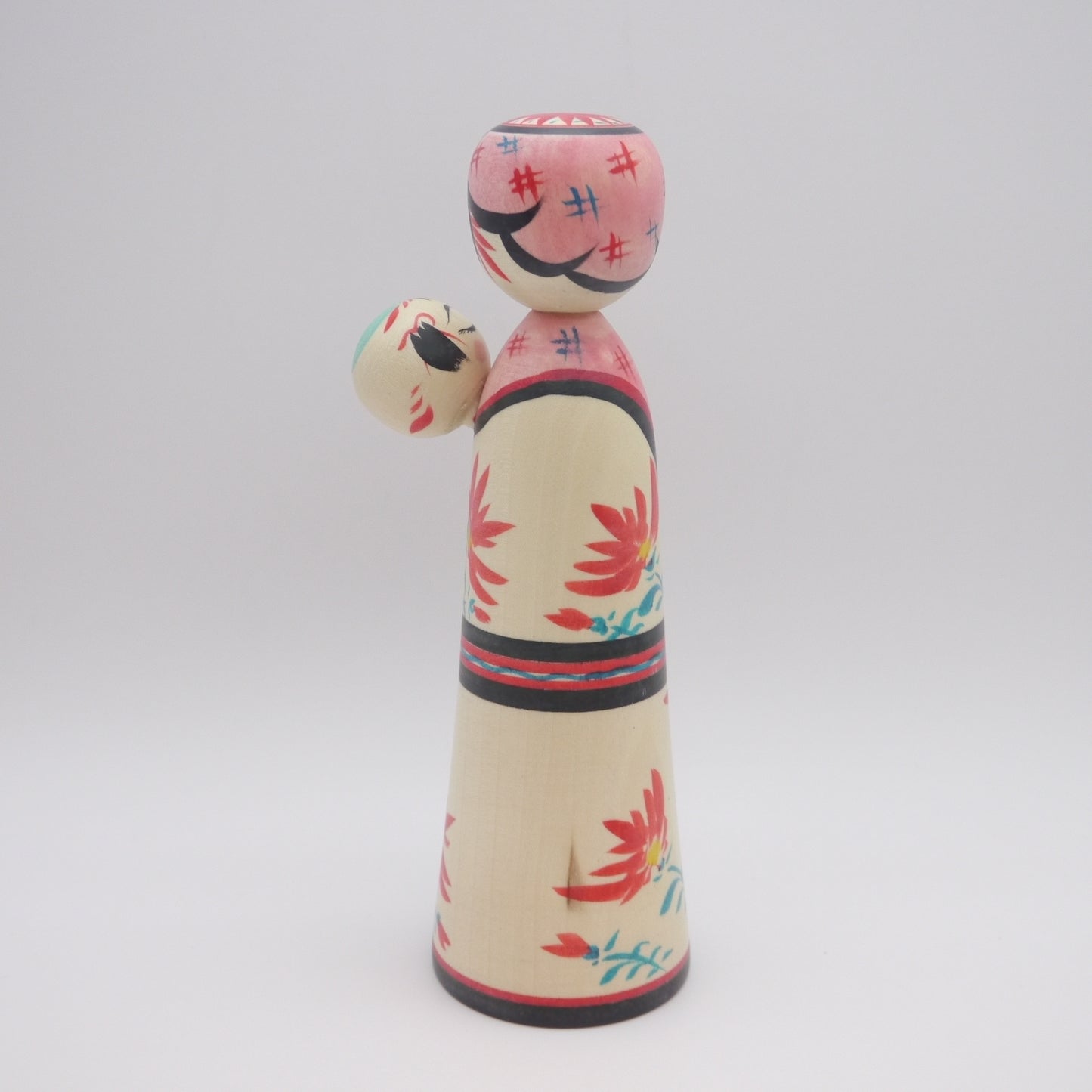 Kokeshi doll by Teruyuki Hiraga Babysitting