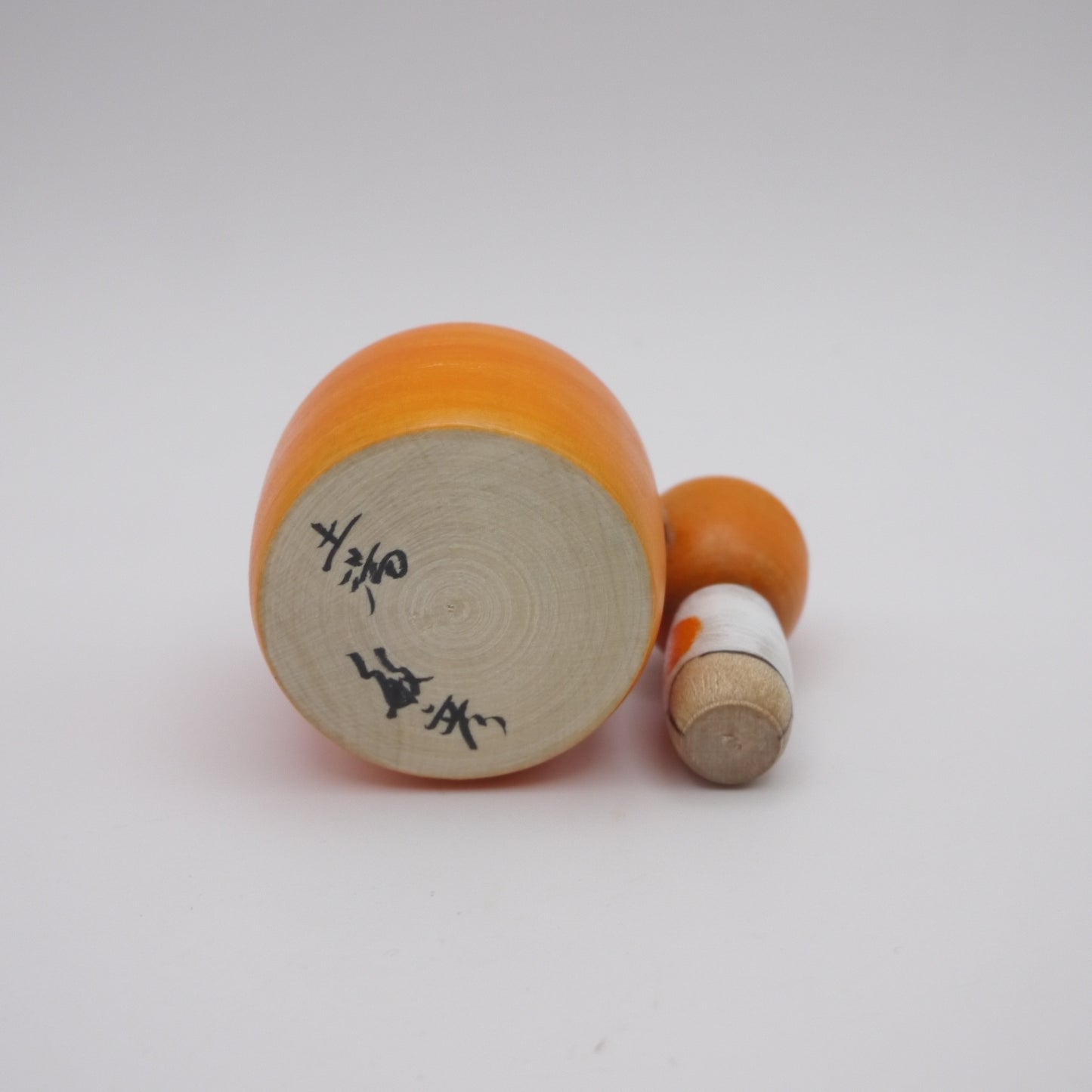116 Kokeshi doll by Toshihiko Nishiyama Orange